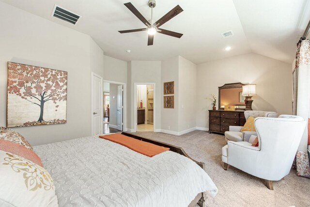 bedroom with lofted ceiling, a ceiling fan, visible vents, and light colored carpet