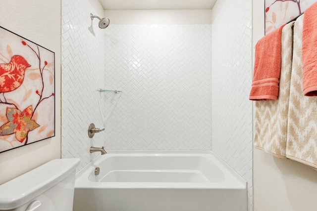 bathroom featuring bathing tub / shower combination and toilet