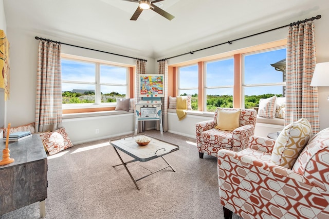 living area with carpet floors, plenty of natural light, and baseboards