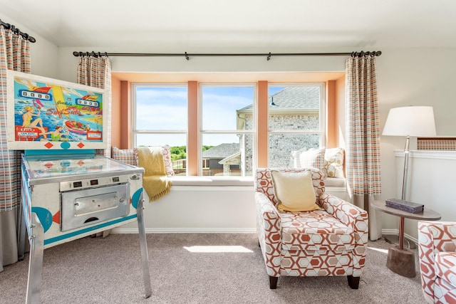 sitting room with carpet and baseboards