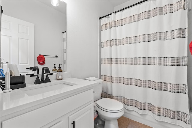 bathroom with tile patterned floors, toilet, and vanity