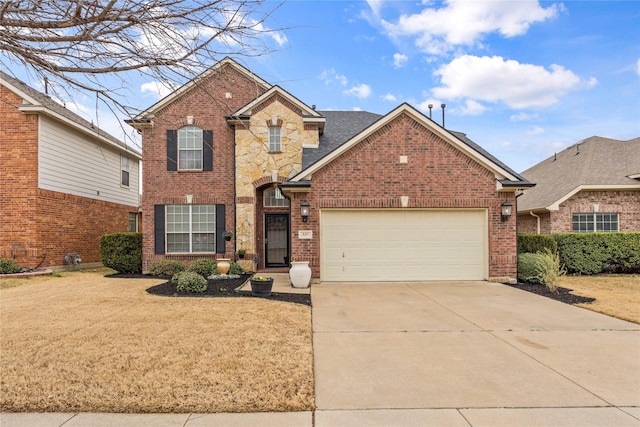 traditional-style house with brick siding, driveway, a front yard, and a garage