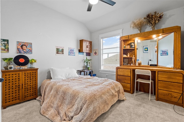 bedroom featuring ceiling fan, carpet flooring, and vaulted ceiling