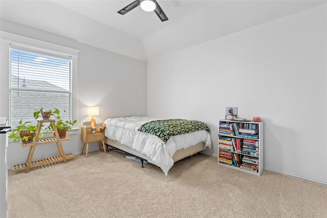 bedroom featuring baseboards, a ceiling fan, lofted ceiling, and carpet floors