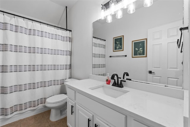 bathroom with tile patterned floors, curtained shower, toilet, and vanity