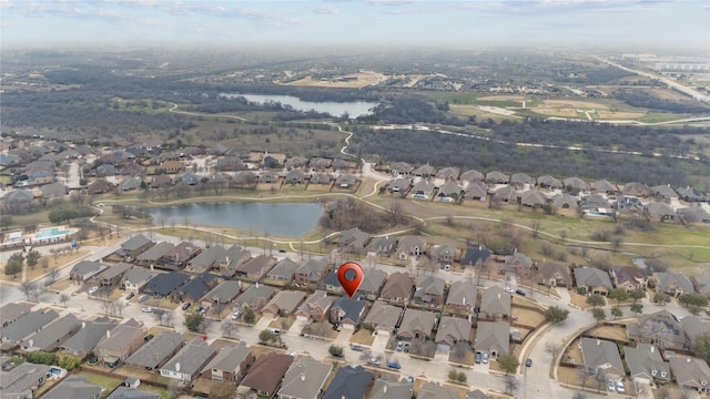 drone / aerial view featuring a residential view and a water view