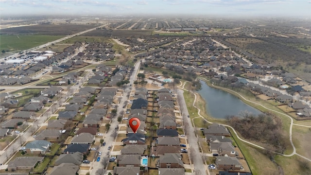 bird's eye view featuring a water view and a residential view