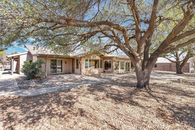 ranch-style house with brick siding