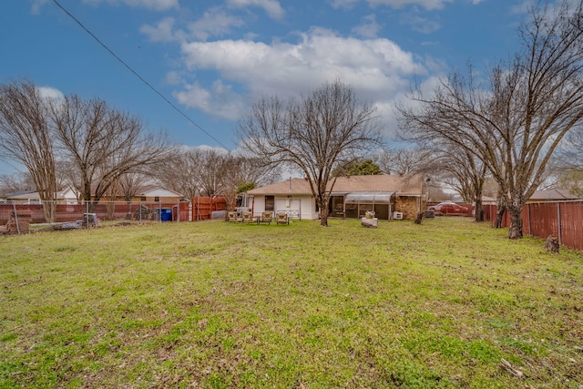 view of yard with a fenced backyard