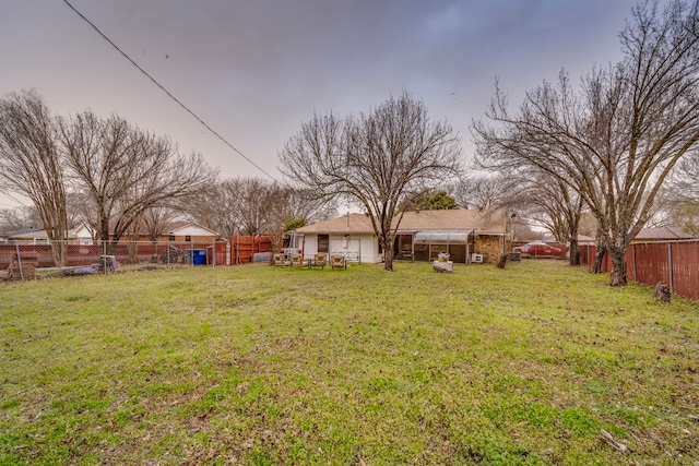 view of yard with a fenced backyard