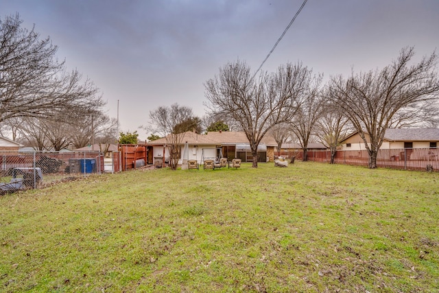 view of yard with a fenced backyard