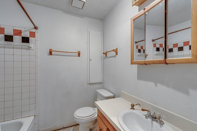 bathroom with shower / bathing tub combination, a textured ceiling, toilet, and vanity