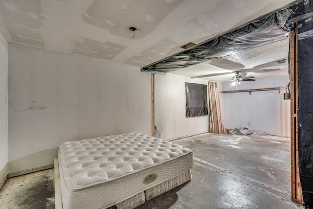 unfurnished bedroom featuring unfinished concrete flooring and ceiling fan