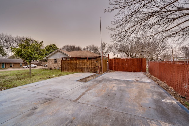 exterior space featuring a yard, a gate, and fence