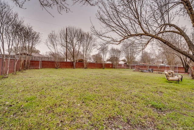 view of yard with a fenced backyard