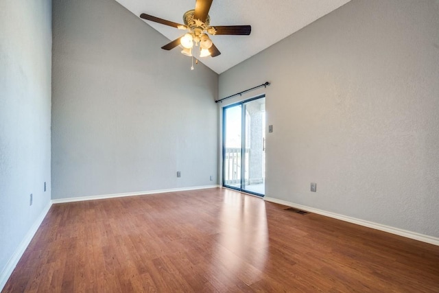 spare room featuring ceiling fan, wood finished floors, visible vents, and baseboards