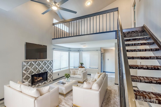 4242 N Capistrano Dr Unit 177, Dallas, TX 75287 - unfurnished living room with a ceiling fan, a fireplace, wood finished floors, and high vaulted ceiling