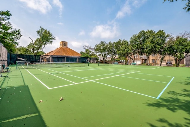 view of sport court with community basketball court and fence