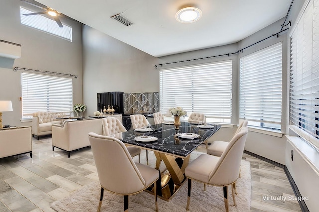 dining room with light wood-type flooring and visible vents