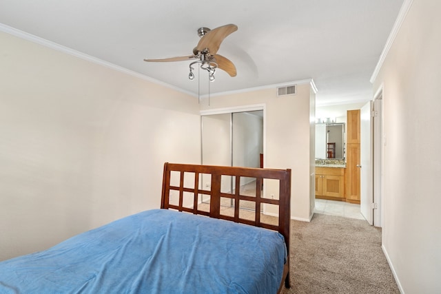 bedroom with carpet floors, baseboards, visible vents, and crown molding