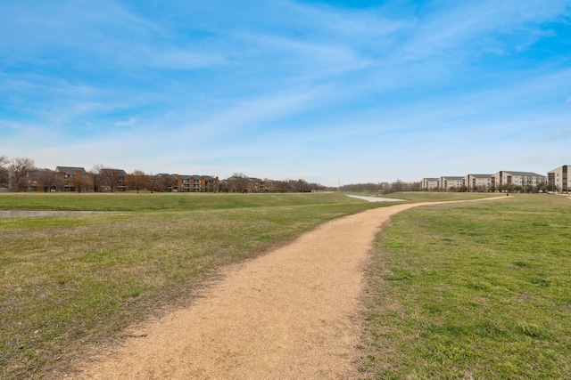 view of home's community featuring a lawn