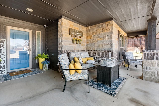 view of patio featuring a porch