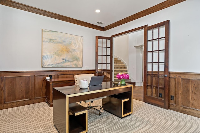 office area with a wainscoted wall, carpet floors, ornamental molding, and visible vents