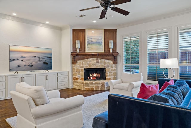 living area featuring ornamental molding, dark wood finished floors, and visible vents