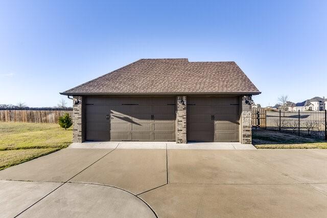 garage with fence