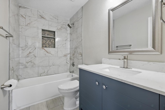 bathroom featuring washtub / shower combination, vanity, toilet, and a textured ceiling