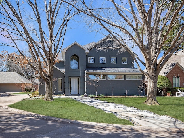 view of front of property featuring a front yard and stucco siding