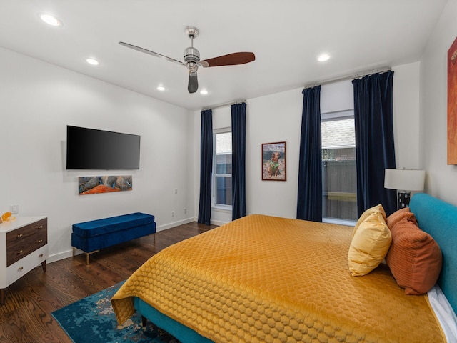 bedroom with baseboards, wood finished floors, and recessed lighting