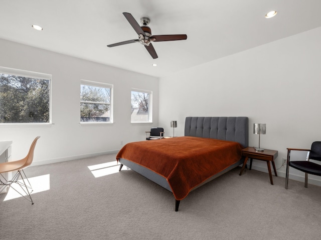 carpeted bedroom featuring a ceiling fan, recessed lighting, and baseboards