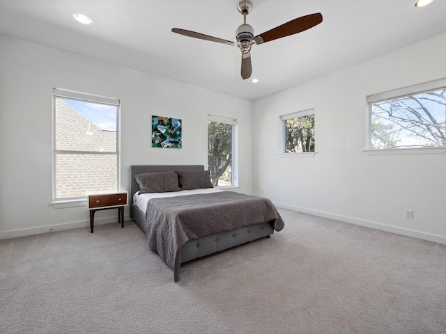 bedroom featuring recessed lighting, baseboards, and light colored carpet