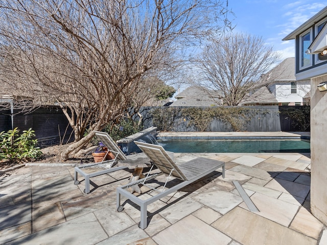 view of swimming pool with a patio, fence private yard, and a fenced in pool