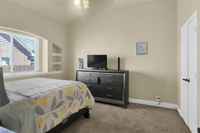 bedroom featuring carpet floors, vaulted ceiling, and baseboards