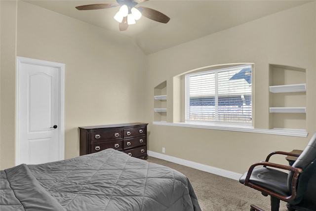 bedroom with a ceiling fan, baseboards, vaulted ceiling, and carpet flooring