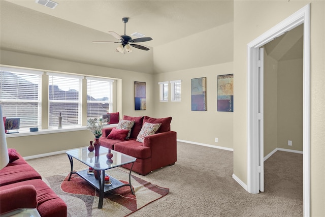 carpeted living area with ceiling fan, visible vents, baseboards, and vaulted ceiling