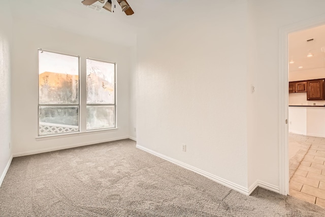 empty room with visible vents, baseboards, a ceiling fan, light colored carpet, and recessed lighting