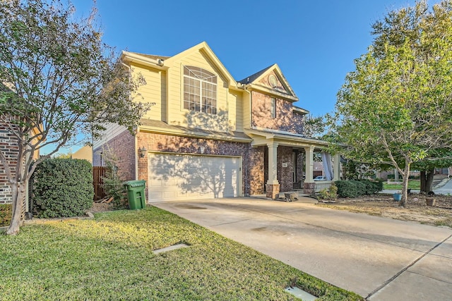 traditional-style home featuring a garage, a front yard, concrete driveway, and brick siding