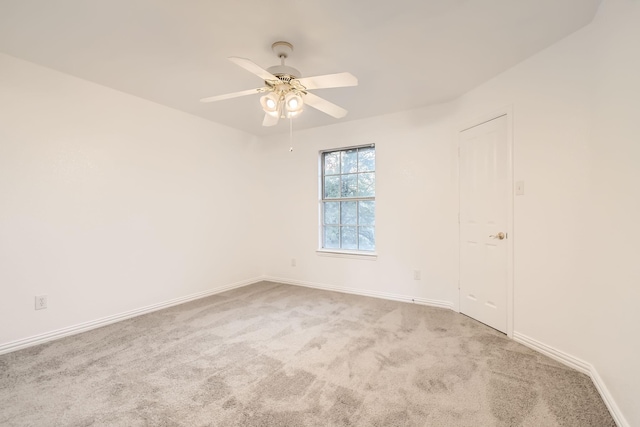 unfurnished room featuring ceiling fan, carpet, and baseboards