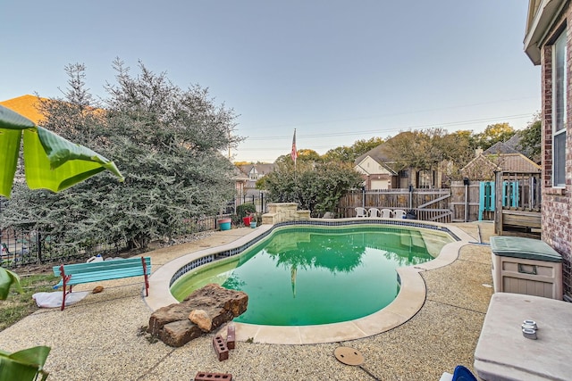 view of pool featuring a fenced in pool, a patio area, and a fenced backyard