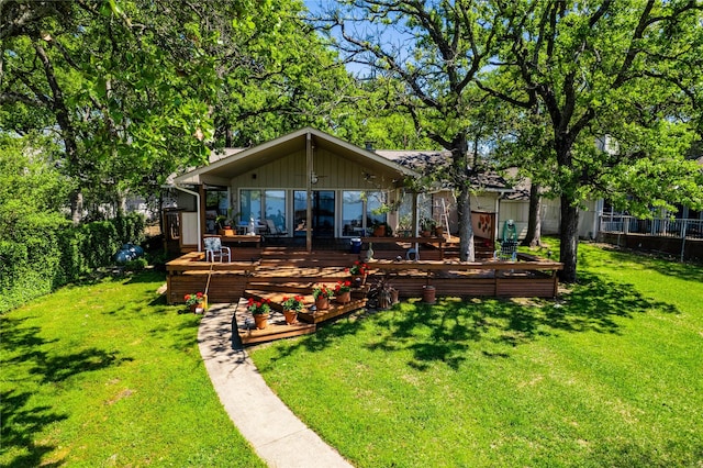 154 Ocean Dr, Gun Barrel City, TX 75156 - back of property featuring fence, board and batten siding, a lawn, and a wooden deck