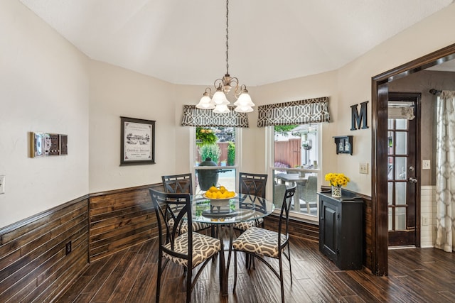 dining room featuring a chandelier, wainscoting, and dark wood finished floors