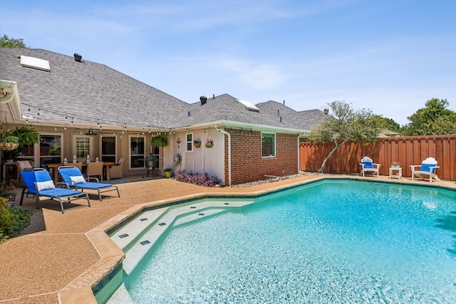 view of pool with a patio, fence, and a fenced in pool