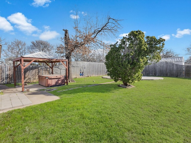 view of yard featuring a gazebo, a patio, a fenced backyard, and a hot tub