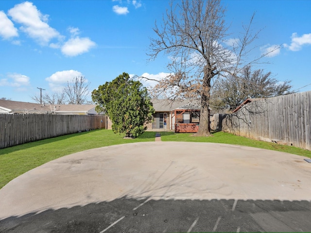 exterior space with a patio area and a fenced backyard