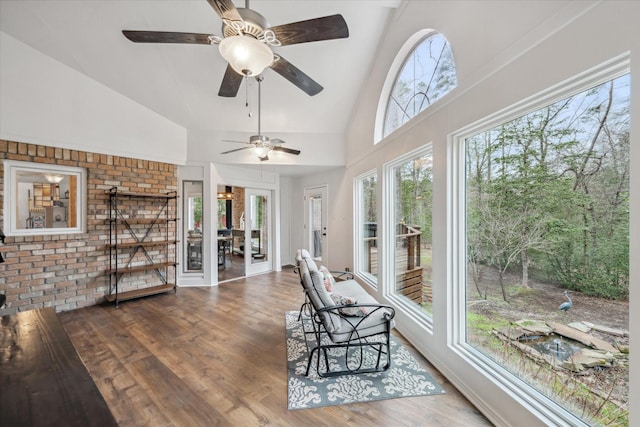 sunroom featuring vaulted ceiling