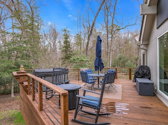 deck with outdoor dining area