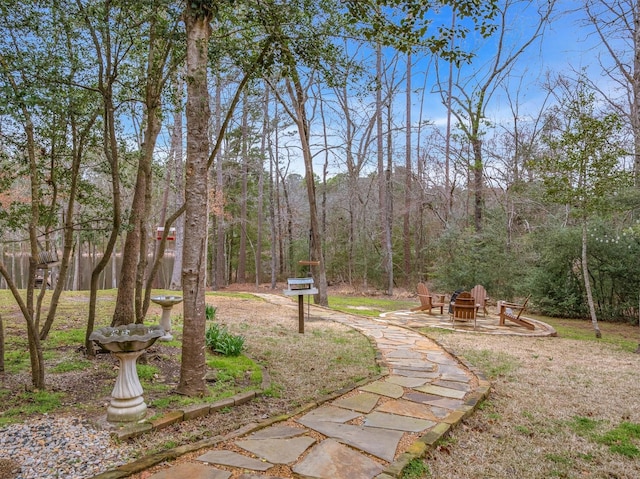 view of yard featuring a view of trees